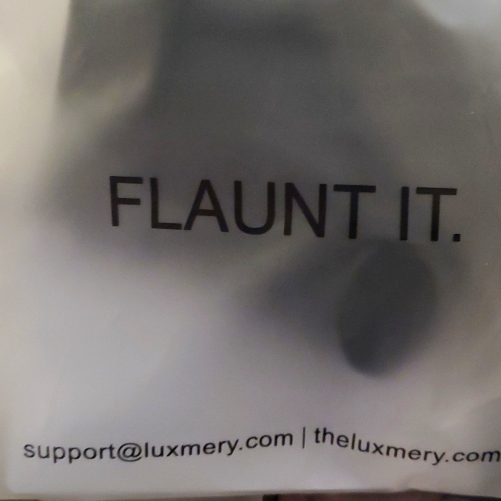 Luxmery bodsuits in black and a  white one same style.
